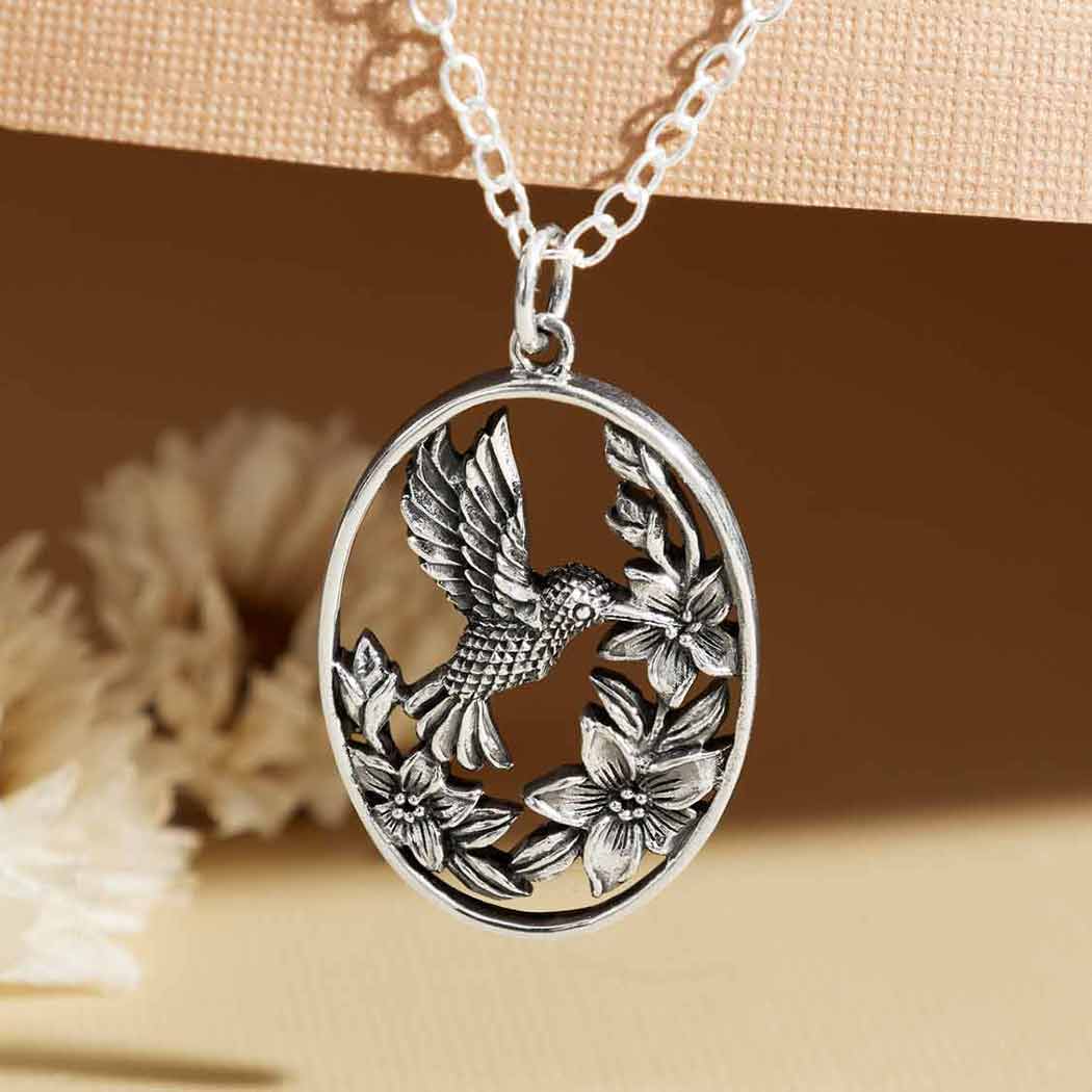 Silver necklace flowers with hummingbird