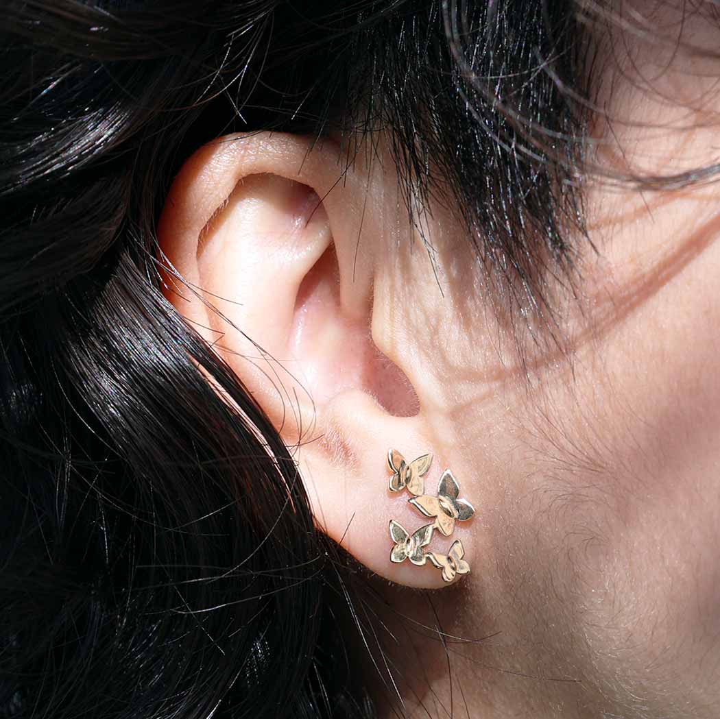 Silver earrings with bronze butterfly swirl